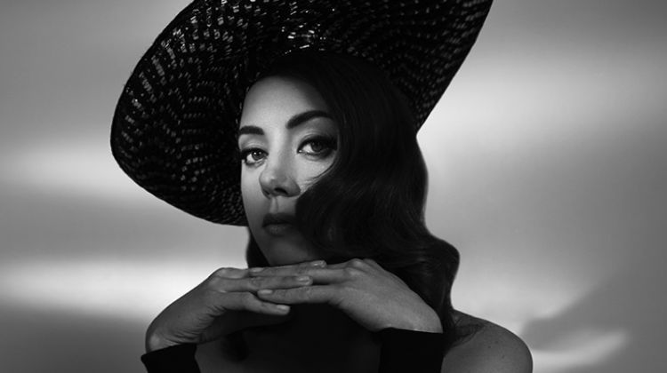 Captured in black and white, Aubrey Plaza wears Anna Kiki top with vintage Dior hat