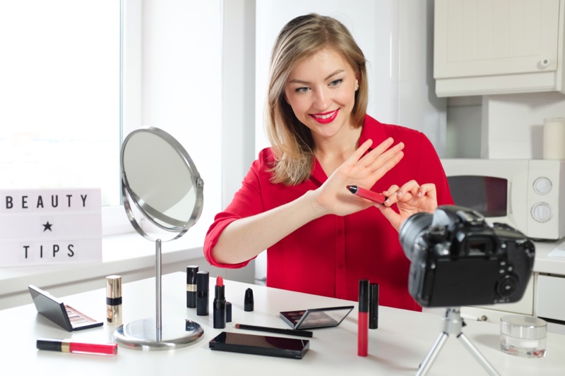 Blonde Beauty Influencer Holding Lipstick