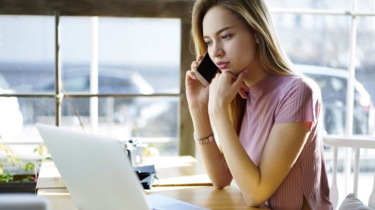 Top 5 Things Every Female Entrepreneur Needs Blonde Woman Looking Laptop Phone