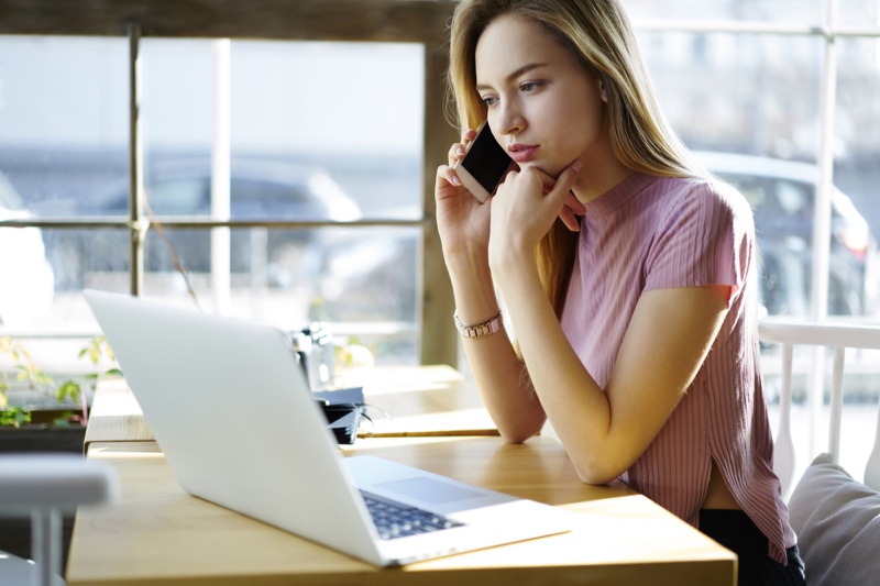 Blonde Woman Looking Laptop Phone