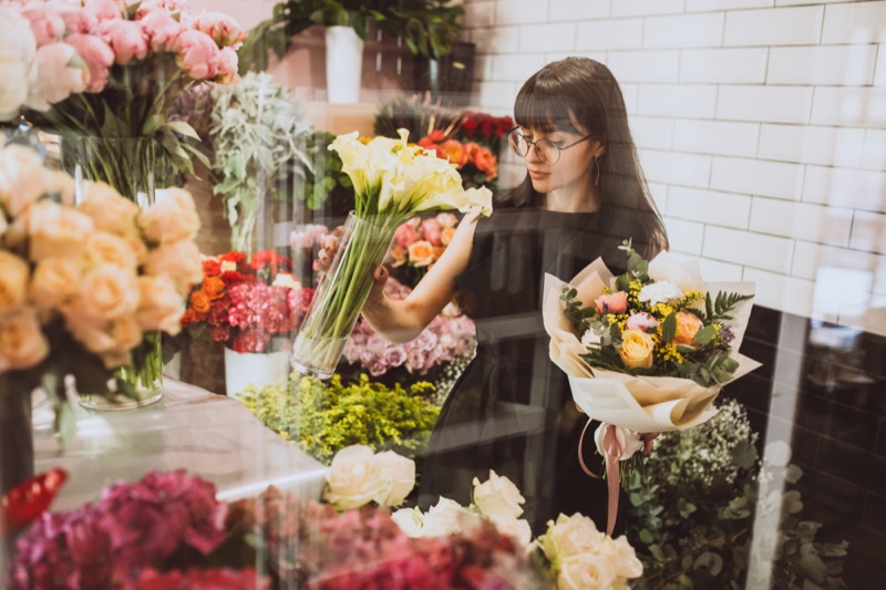 Brunette Woman Holding Flowers Glass