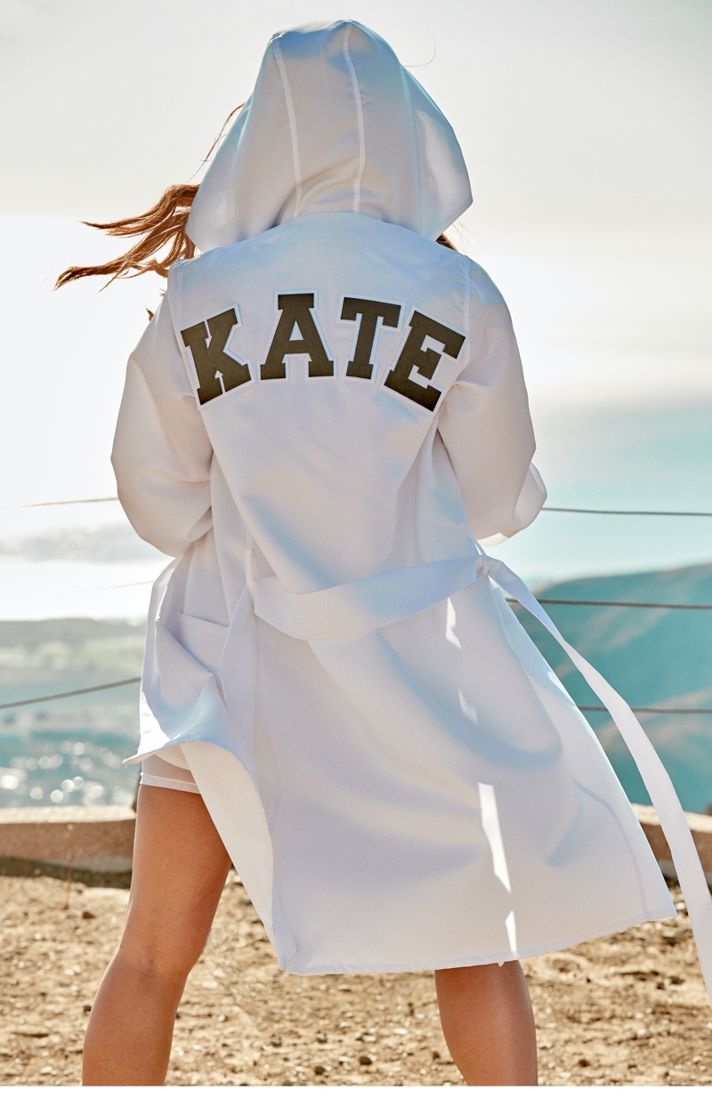 Actress Kate Beckinsale poses in customized robe