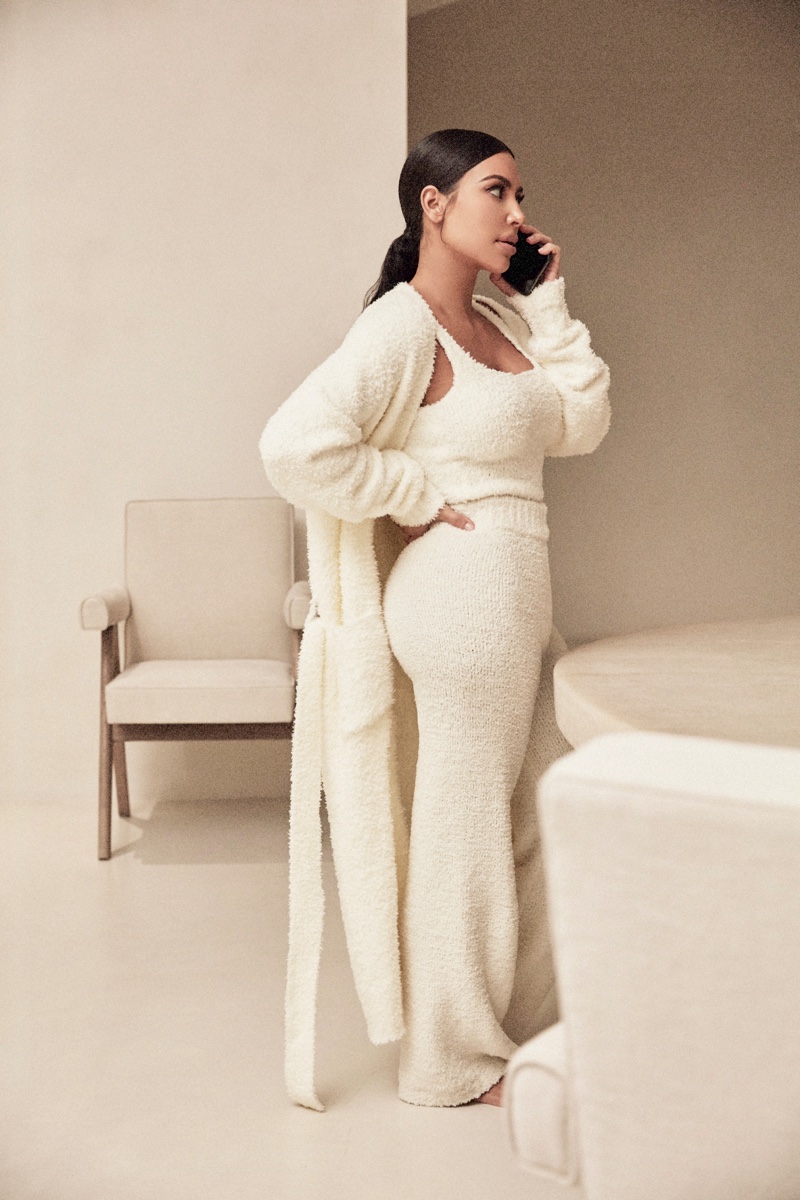 Dressed in white, Kim Kardashian wears SKIMS Cozy Collection