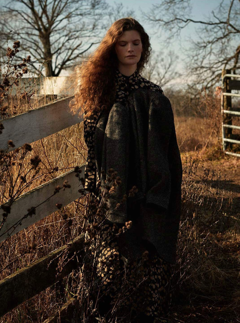 Carolina Burgin poses in Massimo Dutti herringbone cotton and wool coat with floral print dress