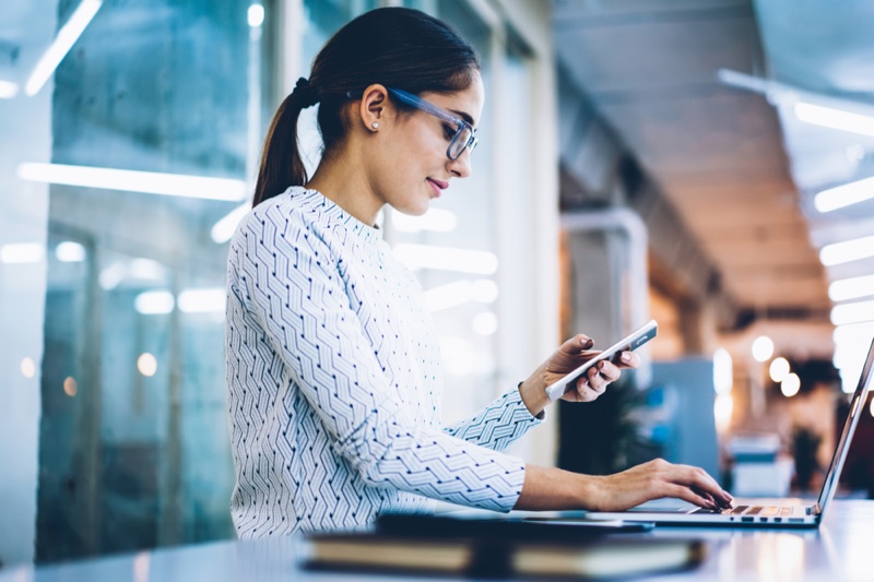 Office Woman Checking Phone Glasses Laptop