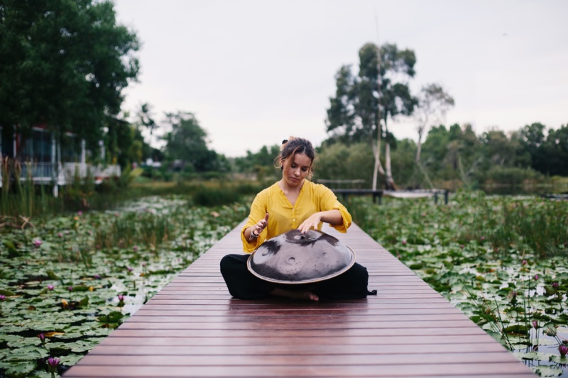 Outdoors Woman Playing Handpan