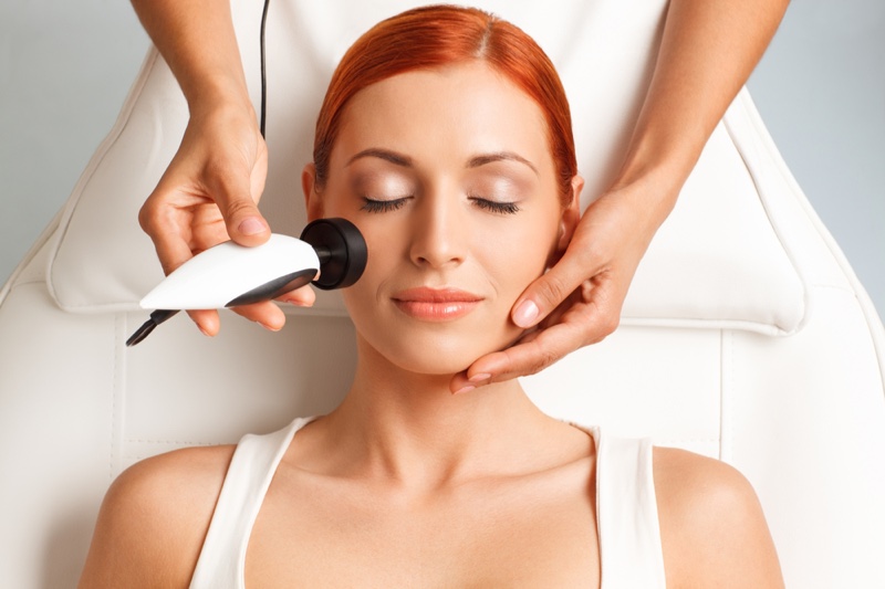 Redhead Woman Radiofrequency Skincare Laser