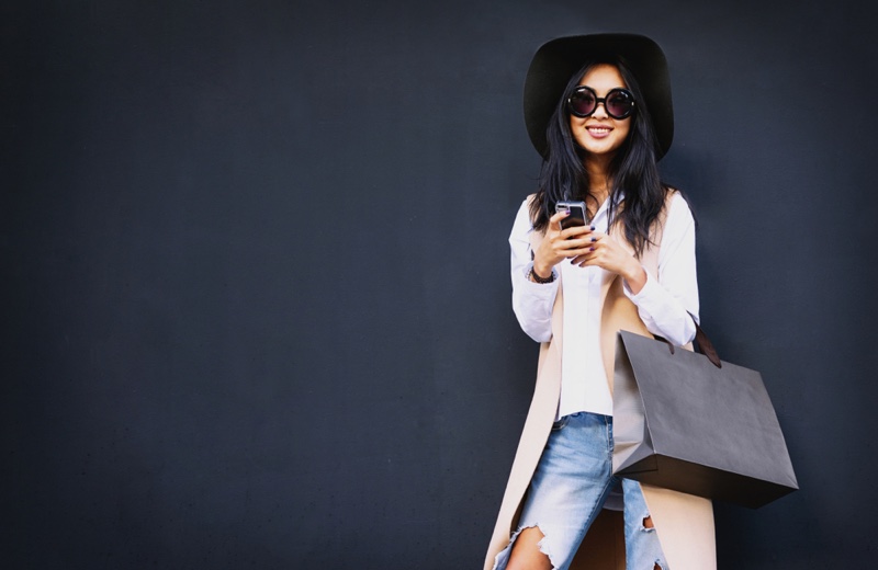 Smiling Woman Shopping Bag Phone Sunglasses Hat Jeans