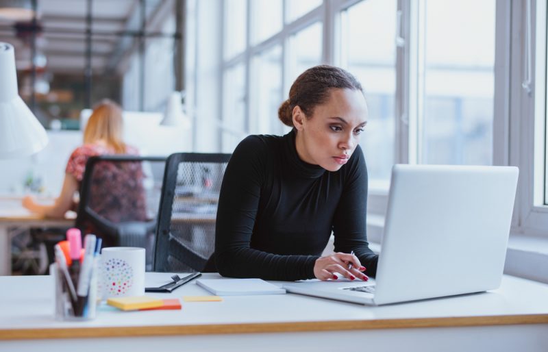 Woman in Turtleneck at Work