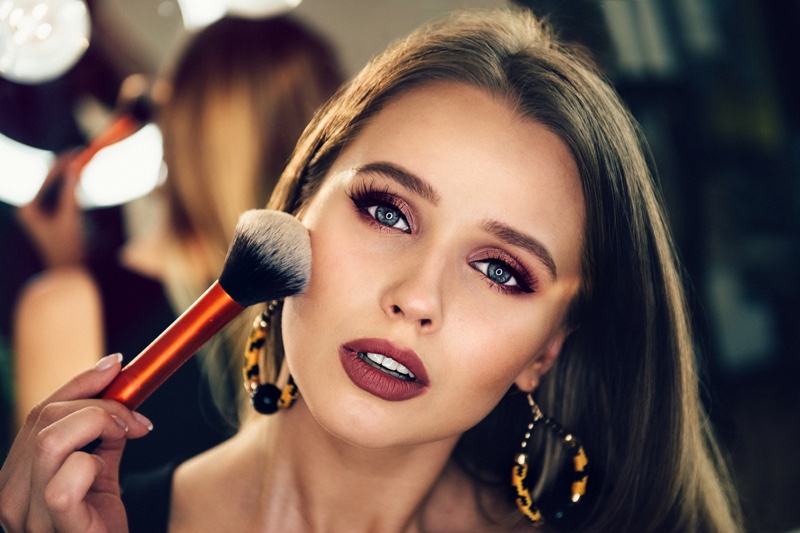 Beauty Model Applying Makeup Hoop Earrings Brush Full Face