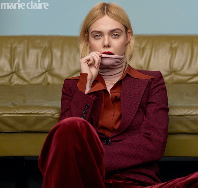 Elle Fanning poses in Victoria Beckham jacket, top and turtleneck with Marc Jacobs pants