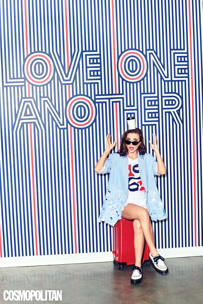 Youtube star Emma Chamberlain wears Vivetta blazer and shorts with Fred Segal top, Dr. Martens shoes and Stella McCartney sunglasses