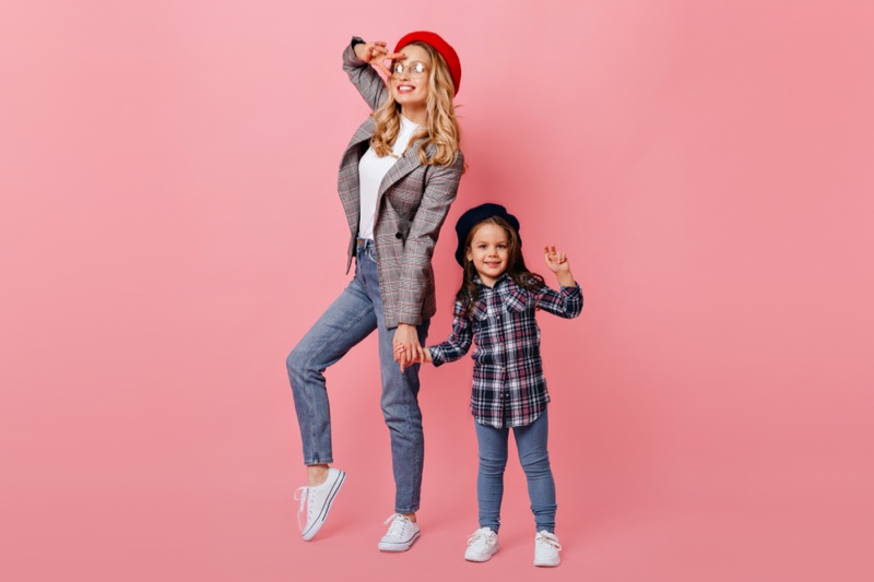 Fashionable Mother Daughter Jeans Pink Background