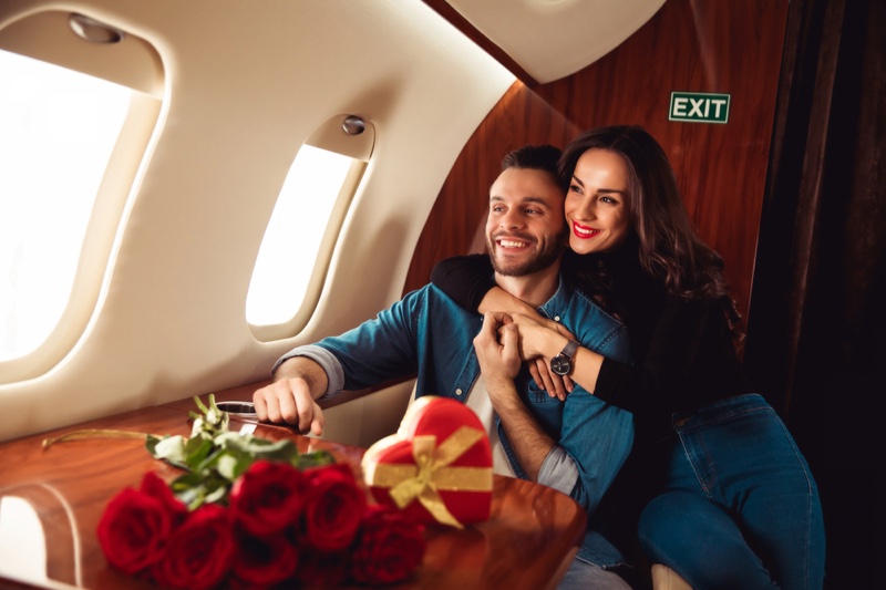 Smiling Couple Plane Roses Heart-Shaped Box