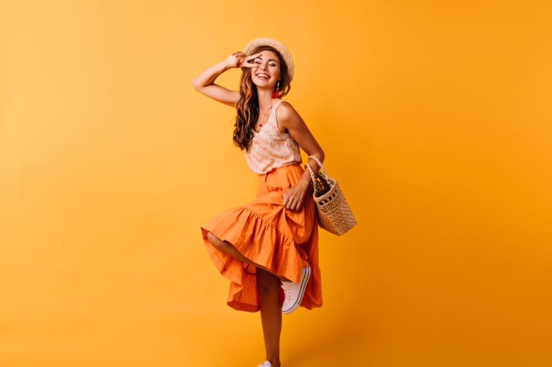 Smiling Model Orange Top Skirt Outfit