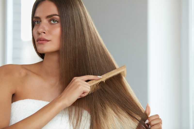 Woman Combing Hair