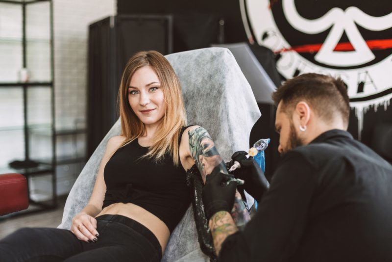 Woman Getting Tattoo