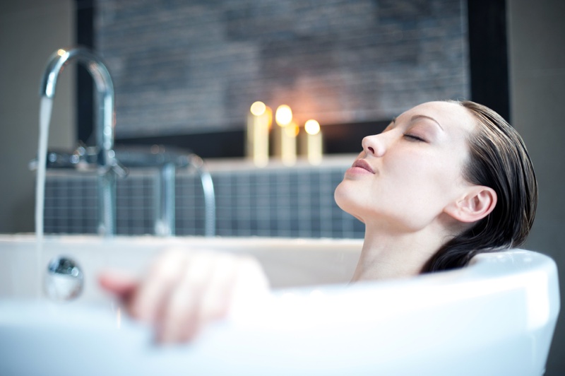 Woman Relaxing Bath Candles Wet Hair