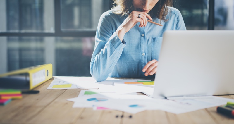 Woman Working Laptop Thoughtful Blue Shirt