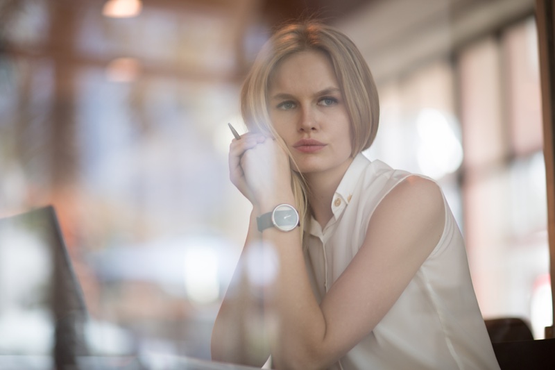 Attractive Blonde Woman Thoughtfully Looking Out Window