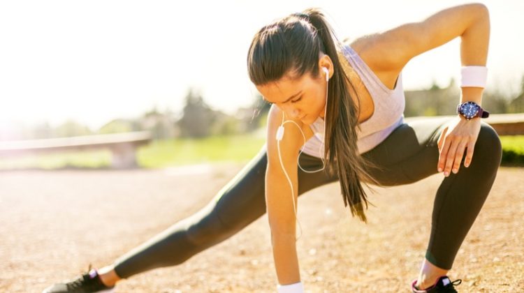 CBD for Fitness & Exercise - Can It Help? Attractive Woman Stretching Workout Clothes