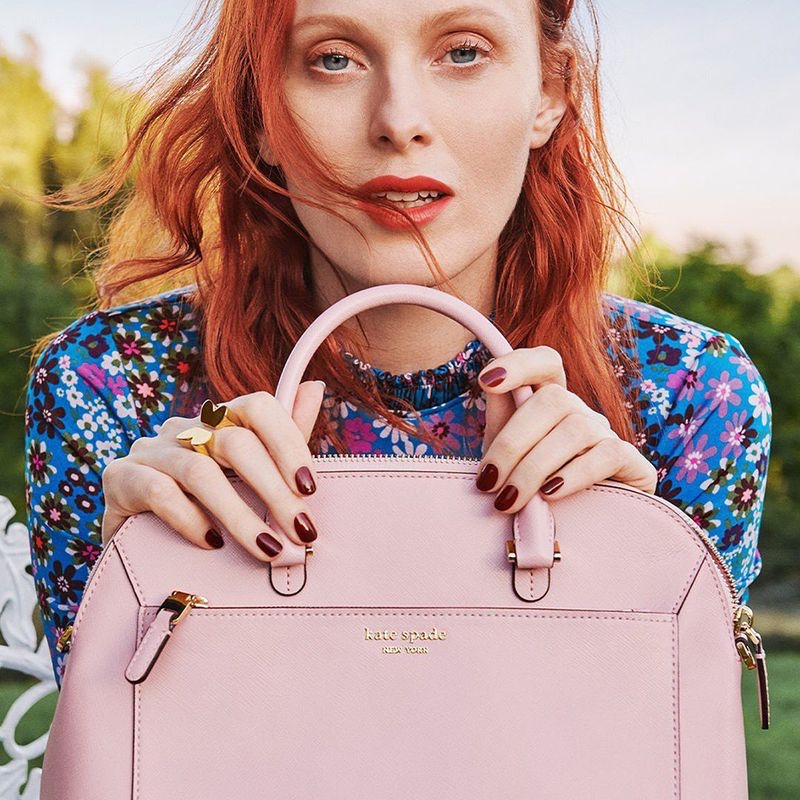 Model Karen Elson poses with pink bag in Kate Spade spring-summer 2020 campaign