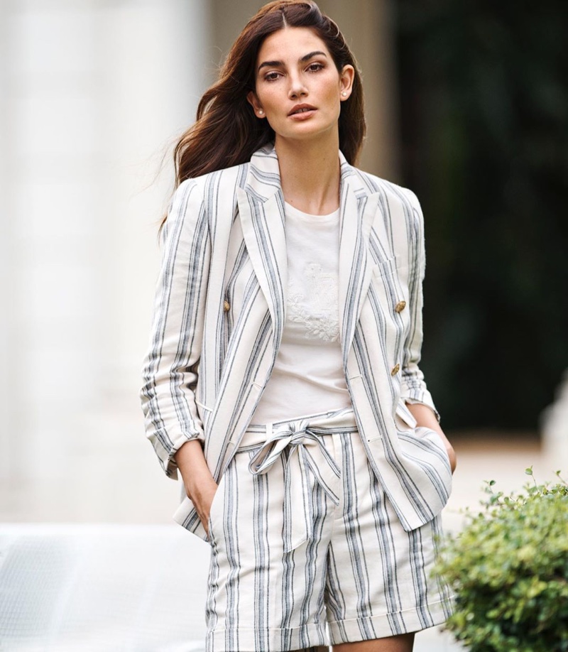 Wearing stripes, Lily Aldridge poses in Lauren Ralph Lauren spring 2020 campaign.