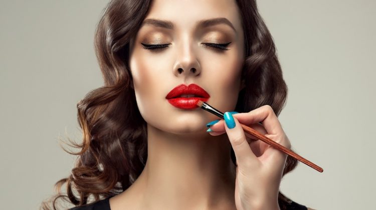 4 Crucial Things to Know Before Going to Cosmetology School Model Getting Makeup Done Red Lipstick Beauty Blue Nails