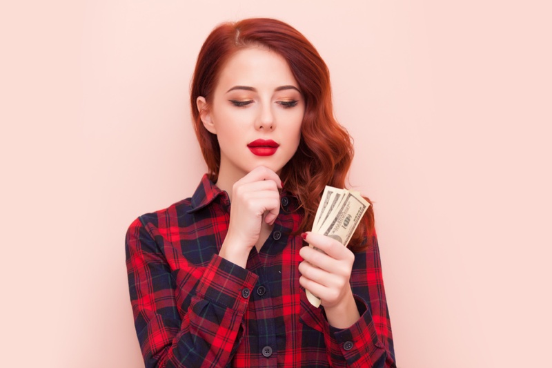 Redhead Woman Plaid Shirt Cash Hand