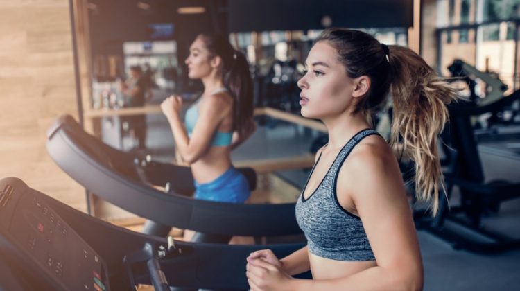 Owning a Fitness Center: What it Takes Two Women Running Treadmills
