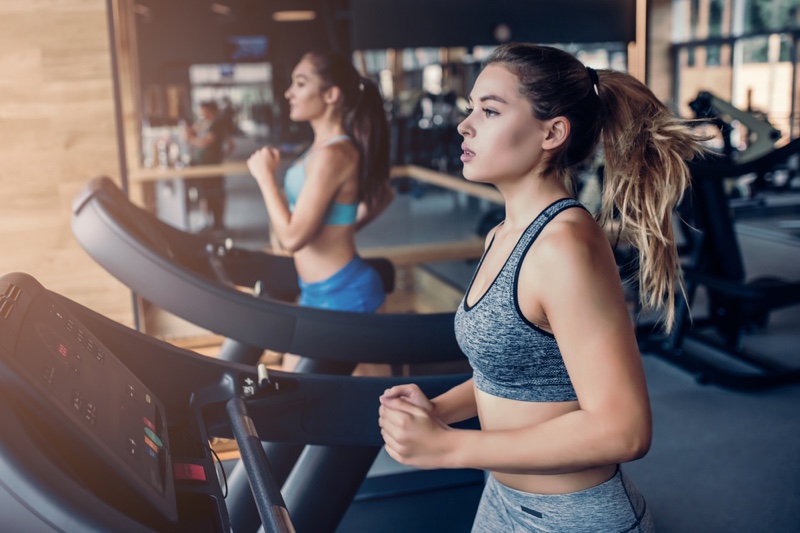 Two Women Running Treadmills