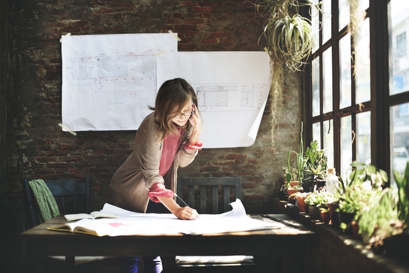 Woman Building Plan Sketches Office