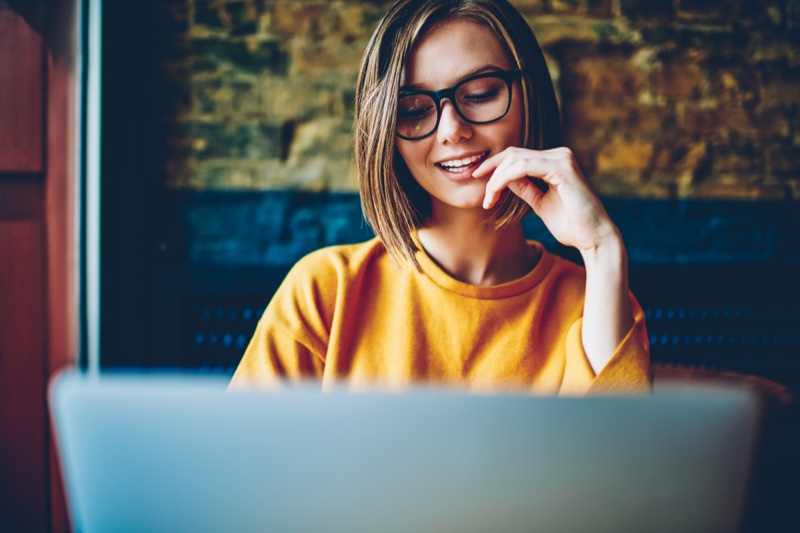 Woman Smiling Laptop Yellow Shirt Glasses