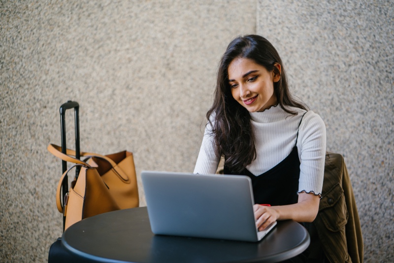 Woman in Layers on Laptop