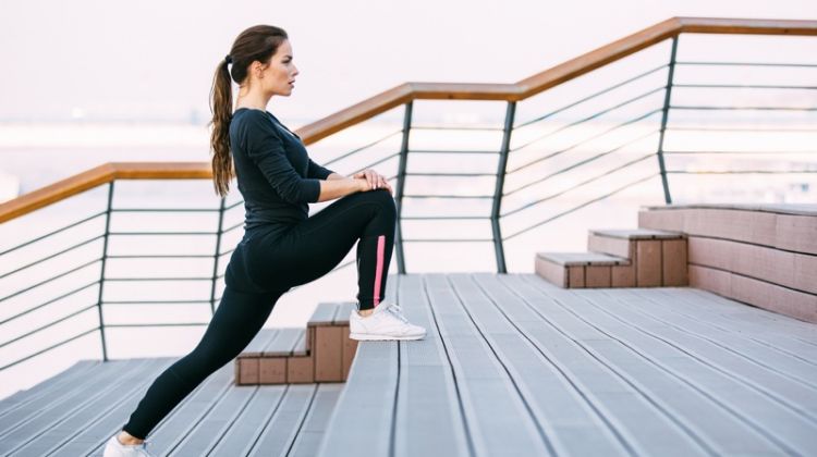 3 Hacks for Speeding Up Weight Loss in a Healthy Way Young Athletic Woman Stretching Before Workout