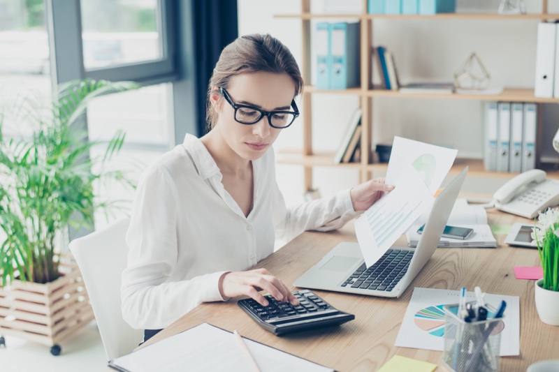 Young Woman Accountant Calculator Laptop Glasses