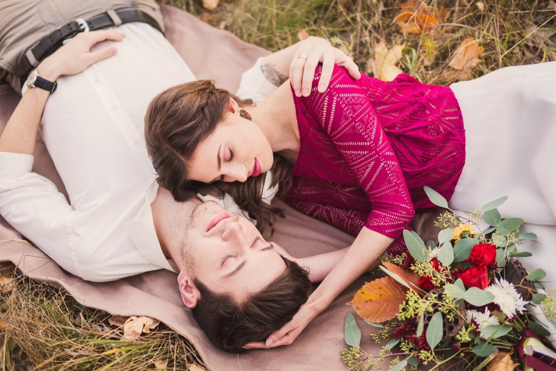 Attractive Couple Laying Grass Embrace Romantic Flowers