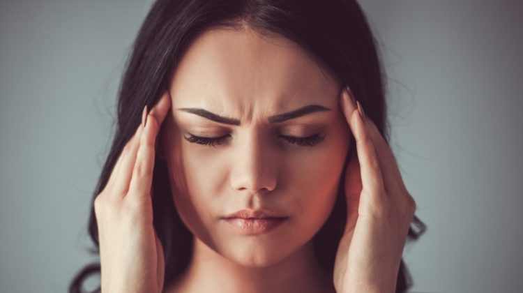 How Stress Can Affect Your Skin Attractive Woman Closeup Face Stress Hands Temple