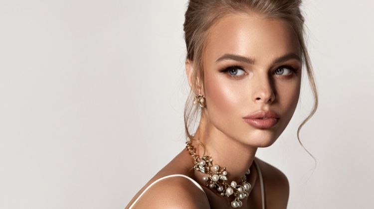 How to Select the Right Designer for Jewelry? Beautiful Blonde Model Wearing Diamond & Pearl Jewelry