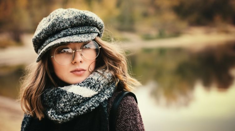 Eyeglasses 101: Debunking Myths For Facts Brunette Woman Round Glasses Newspaper Boy Cap Cold Weather Style