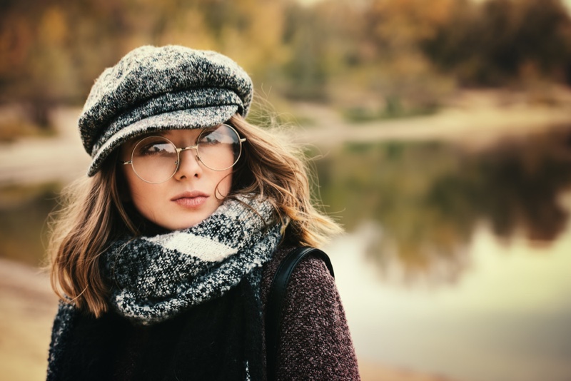Brunette Woman Round Glasses Newspaper Boy Cap Cold Weather Style