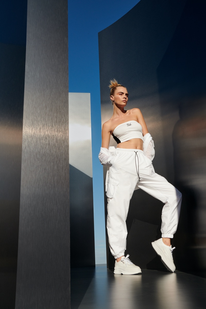 Model and actress Cara Delevingne poses in PUMA Deva White sneaker