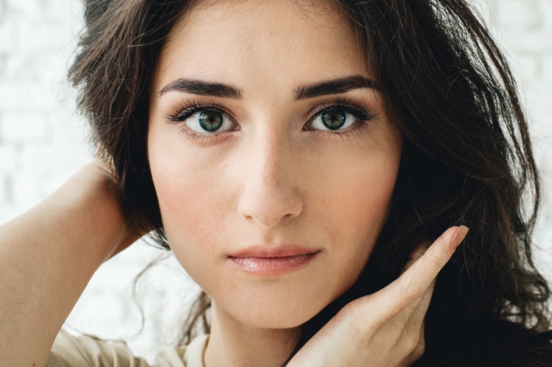 Closeup Dark Haired Woman Piercing Eyes