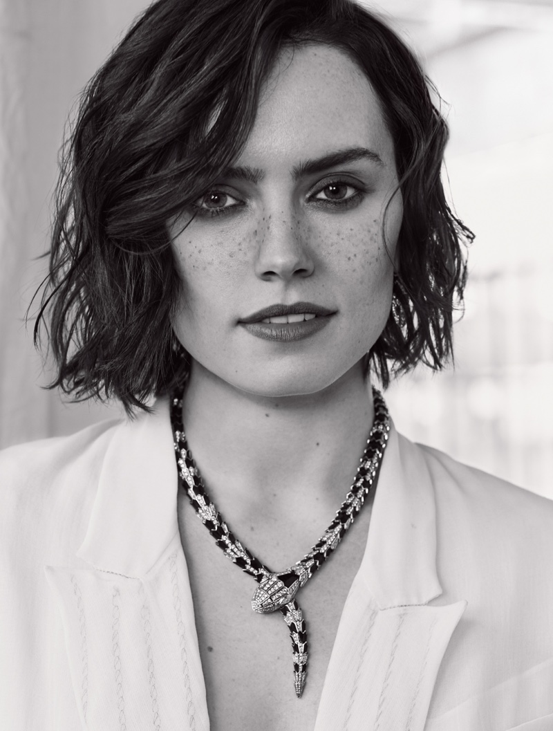 Actress Daisy Ridley poses in black and white