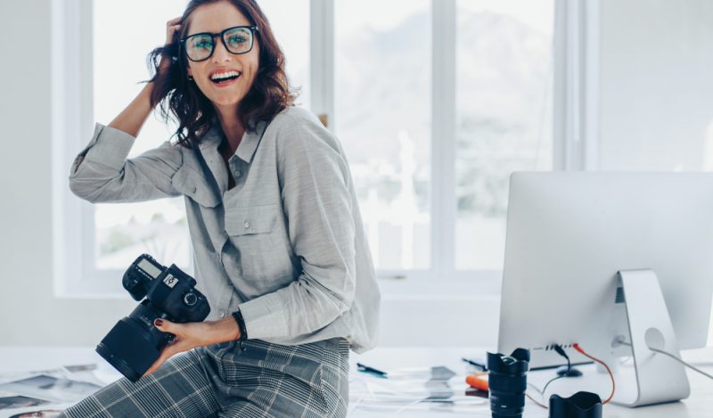 Female Photographer by Computer