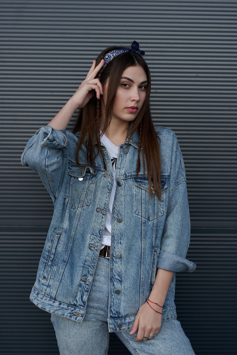 Premium Photo | Portrait of young beautiful female with hands near face in denim  outfit and looking glad front view