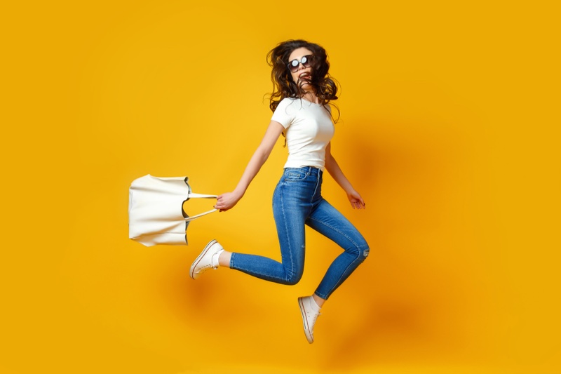 Jumping Woman White T-Shirt Skinny Jeans Bag