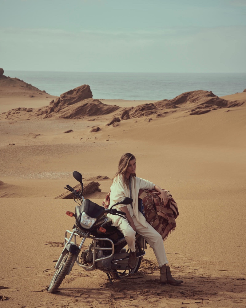 Posing on a motorcycle, Luna Bijl fronts Free People March 2020 catalog