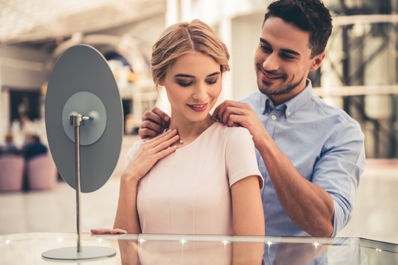 Man Gifting Woman Necklace Couple Jewelry Store