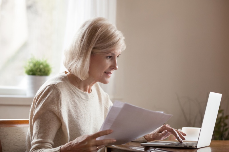 Older Woman Papers Laptop